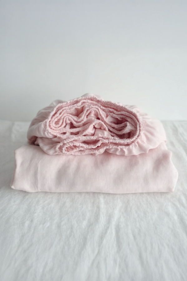 Pastel pink linen fitted sheet